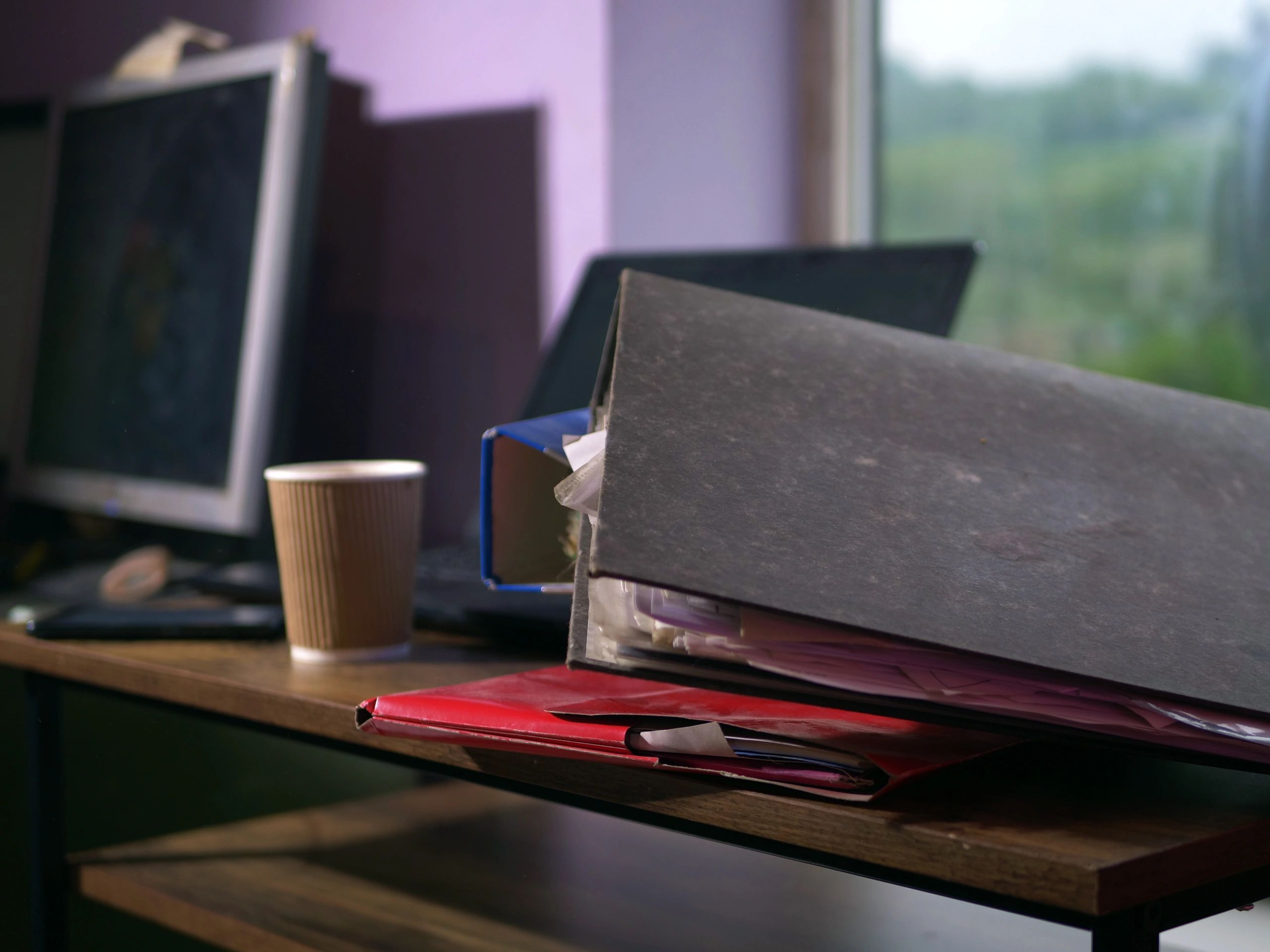 Office desk with folders and files representing transportation business paperwork