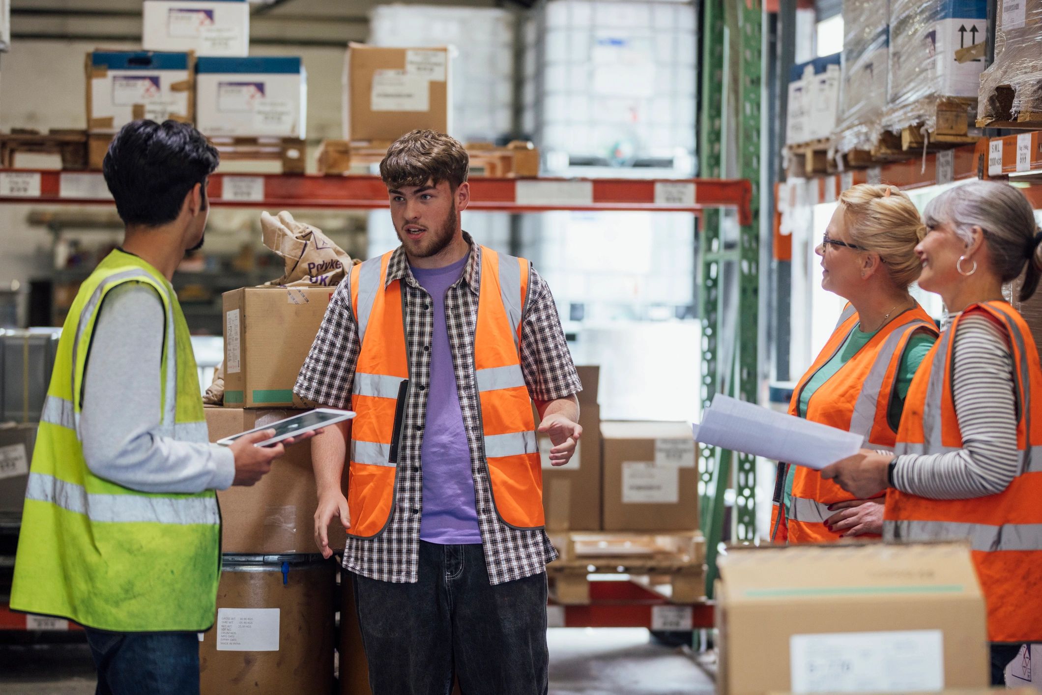 Logistics team in discussion with paperwork
